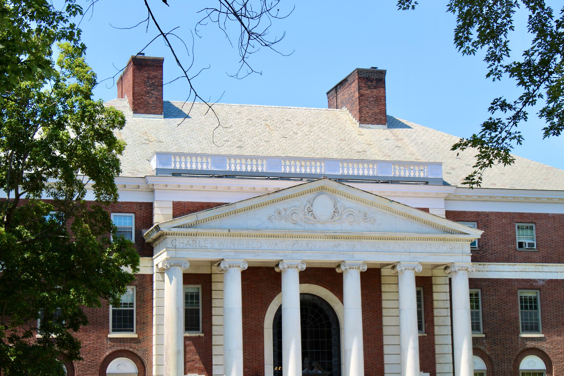 Columned academic building on a university campus.